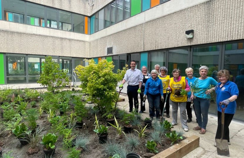 MP helps plant tree at hospital 'quiet area'  