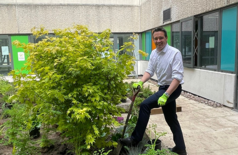 MP helps plant tree at hospital 'quiet area'  